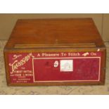 A vintage oak shop counter top haberdashery cabinet enclosing a full length drawer, the front