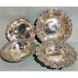 Four various continental white metal (untested) dishes, the largest 28cm diameter (4)