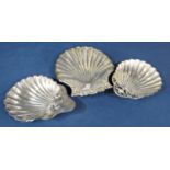 Three various silver novelty scallop shell dishes, various dates and makers, the largest 13 x