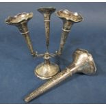 Unusual hammered silver epergne, the large central trumpet framed by three further smaller trumpets,