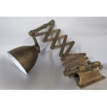 A good quality vintage industrial brass telescopic scissor wall lamp, with brass shade and wall