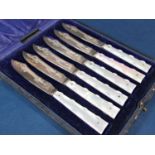 Cased set of six good quality silver bladed fruit knives, the blades with engraved decoration,