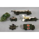 4 unboxed Dinky military model vehicles including Missile Erector, Military Ambulance, Missile