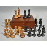 Boxwood and ebony chess set in the Staunton style. CR; finial missing on black king, chips