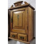 Aesthetic period oak hanging wall cupboard, with raised architectural swan neck pediment over a