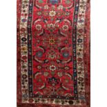 Antique Persian full pile Hammadam runner with geometric floral medallion decoration upon a washed