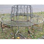 A contemporary sectional light steel framed tree seat, with simple open scroll work detail, 160cm