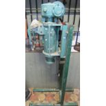 A cast iron floorstanding potters electric pug mill
