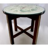 Unusual Omega type coffee table, the top painted with three regal ladies upon painted chamfered teak