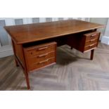 Gunni Omann teak twin pedestal desk, the floating top over two pedestals fitted with three short