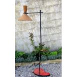 Unusual 1950s standard lamp, with japanned steel frame upon an artists palette shaped red