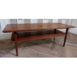 Danish teak two tier long coffee table upon circular tapered legs, 122cm long x 45cm high