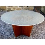 Unusual 1960s teak and glass lighted coffee table, the opaque circular top with clear sunburst