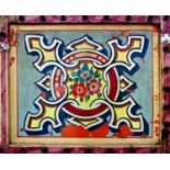 Early vintage painted tin fairground amusement panel with typical floral shield decoration, framed