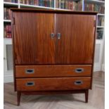 Jan Kuypers for Imperial afromosia tallboy or gents robe, the twin doors enclosing a shelved and