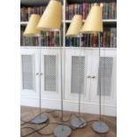 Unusual set of four Italian mid-century chrome and iron floor lamps, the circular bases cast with