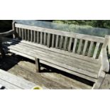 A good quality weathered teak garden bench, 240cm long