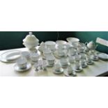 A collection of contemporary French tableware, cups and saucers (two sizes) soup bowls, lidded