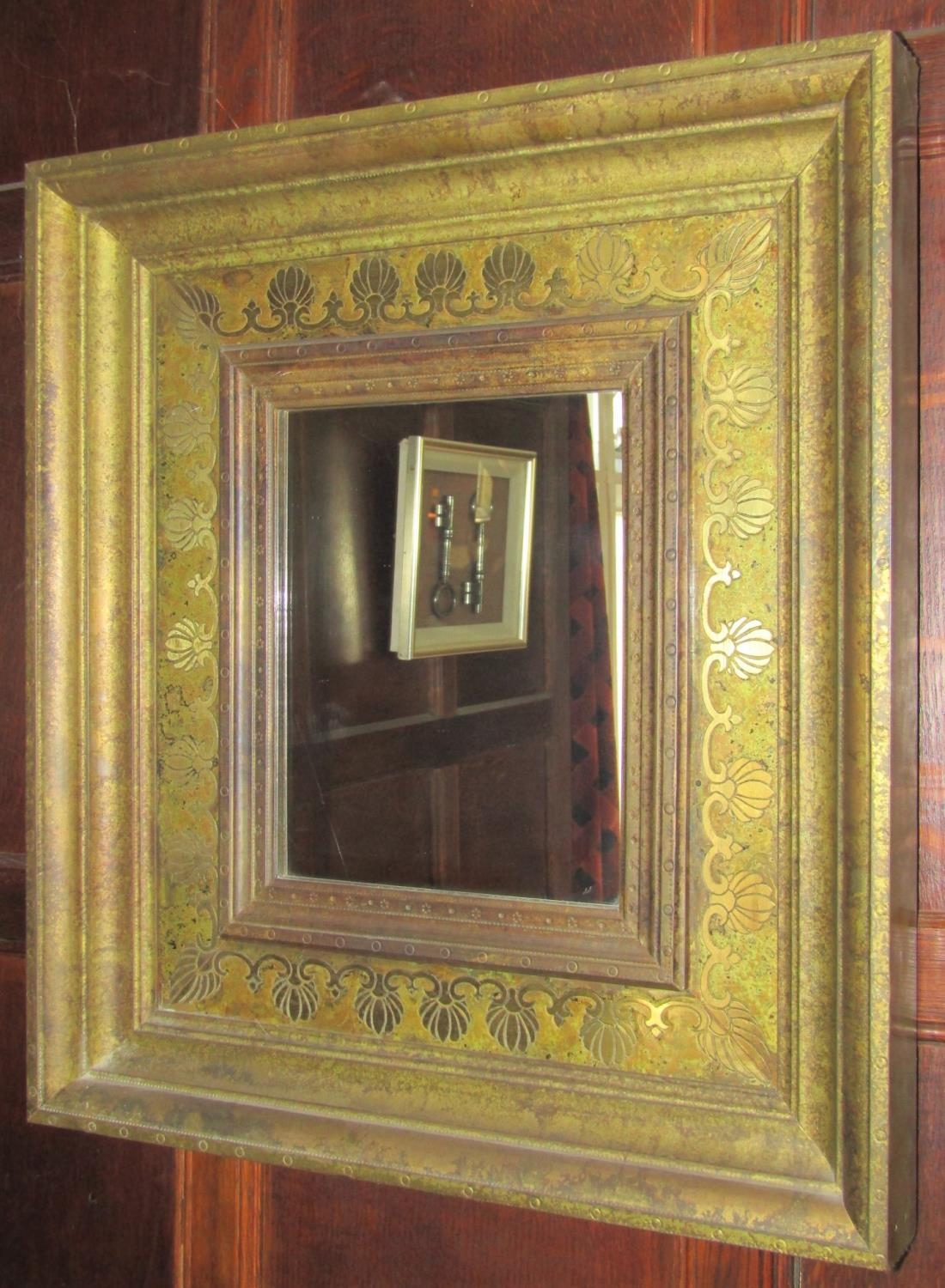Contemporary gilded wall mirror of rectangular form in an antique style, the inner slip with