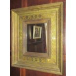 Contemporary gilded wall mirror of rectangular form in an antique style, the inner slip with