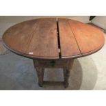 19th century rustic pine drop leaf table, the top of oval form over two frieze drawers, raised on