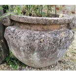 Pair of re-constituted stone urns with scrolled handles