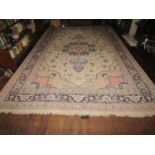 A large eastern wool carpet with pale cream ground, with central medallion, abstract floral detail