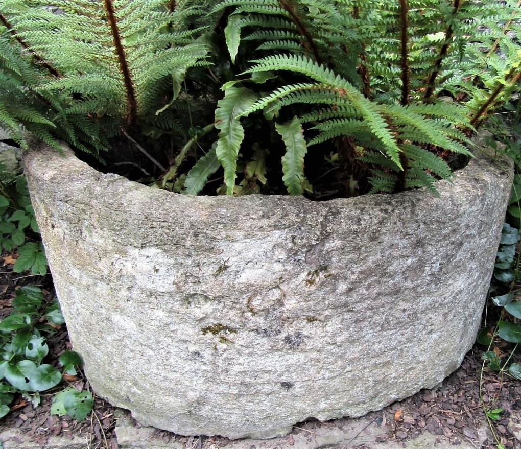 An ancient limestone D end trough, 85cm deep x 95cm wide x 45cm high approx