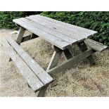 A weathered teak picnic bench, 152cm long
