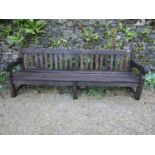 A good quality teak garden bench, 240cm long approx