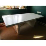 A rise and fall white painted work table on stretcher framework (needs recommissioning)