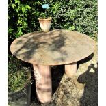 A circular garden table with weathered marble finish, the 120cm diameter top raised on three