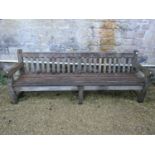 A good quality teak garden bench, 240cm long approx