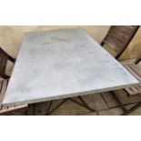 A vintage style café table, the rectangular top zinc lined, 120cm x 80cm, raised on an ironwork base