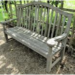 A weathered teak wood garden bench, 160cm wide