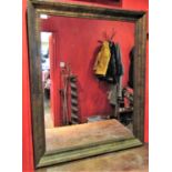 A contemporary wall mirror with antiqued simulated marbled finish, 1m x 80cm