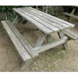 A weathered teak picnic table, 152cm long