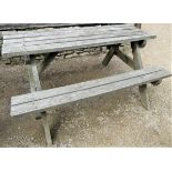 A weathered teak picnic table, 152cm long