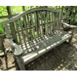 A weathered teak garden bench, 160cm wide