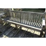 A good quality weathered teak garden bench, 240cm long