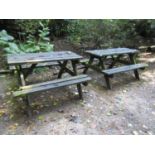 Two weathered picnic tables