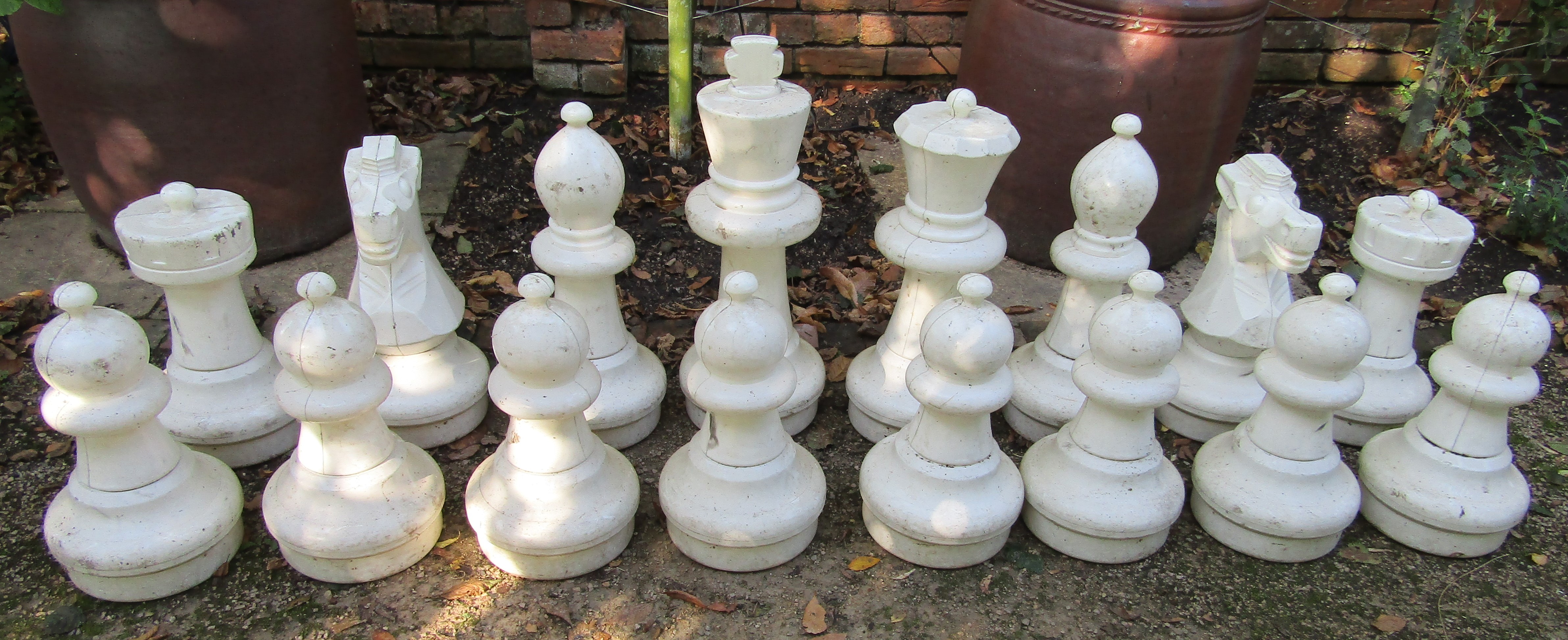 A set of large plastic chess pieces (full set) for garden use