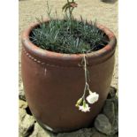 A salt glazed barrel shaped planter with simple rope twist moulded detail, 60cm high