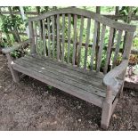 A weathered teak wood garden bench, 160cm wide