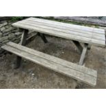 A weathered teak picnic table, 152cm long