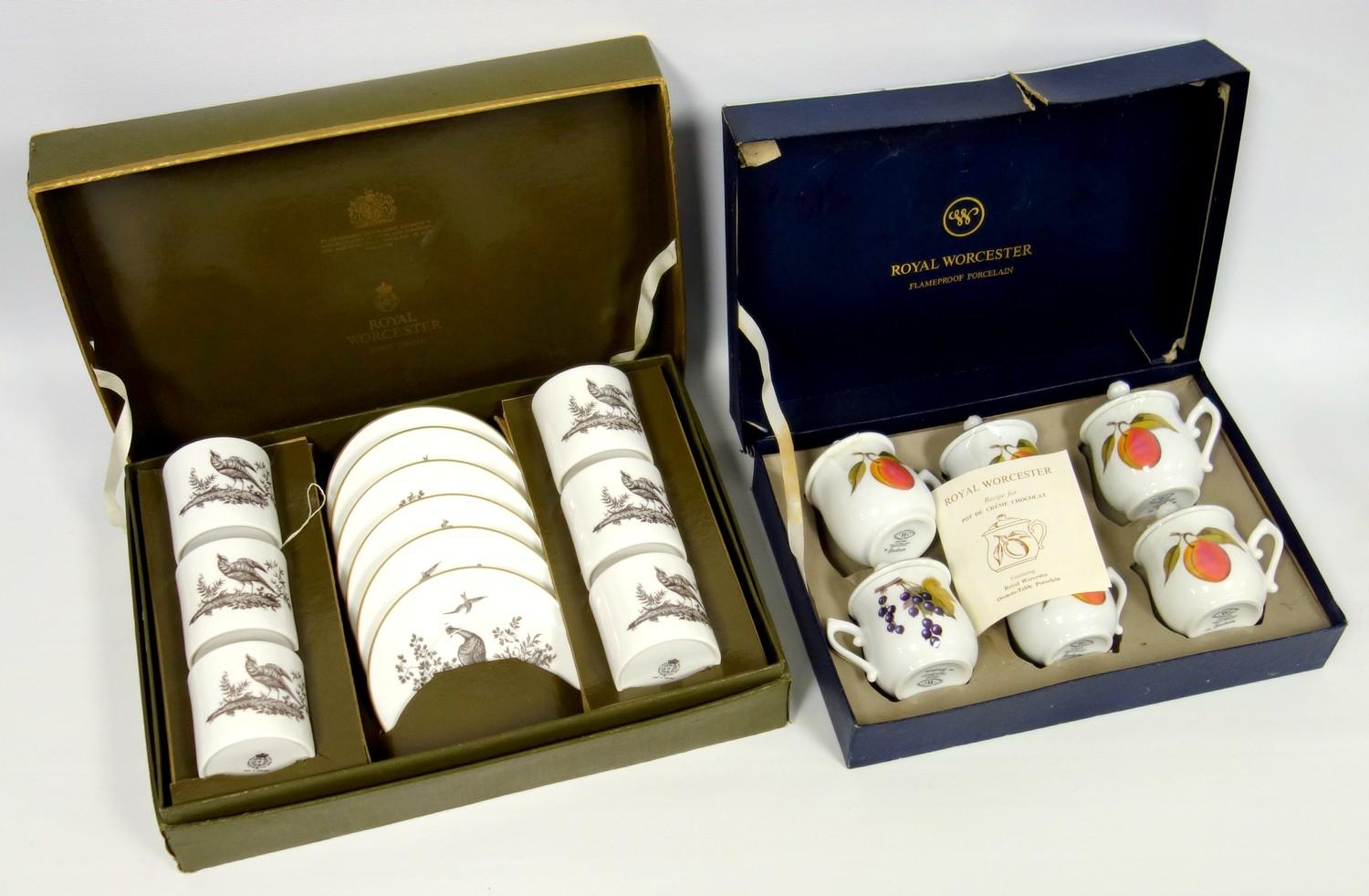 A set of Worcester coffee cans and saucers, with bat print style peacock design, and a set of lidded