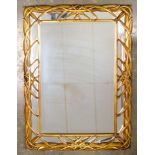 Gilt framed wall mirror of interlocking geometric design, 92 cm x 72.5 cm.