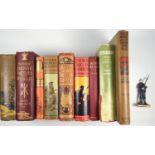 A group of military books with decorative bindings, Battles of The British Army, South Africa and