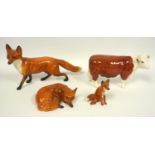 Beswick Champion Hereford Cow, and a group of Beswick foxes (4)