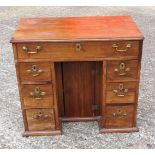 19th Century mahogany kneehole desk with one long drawer and three graduated drawers on each side